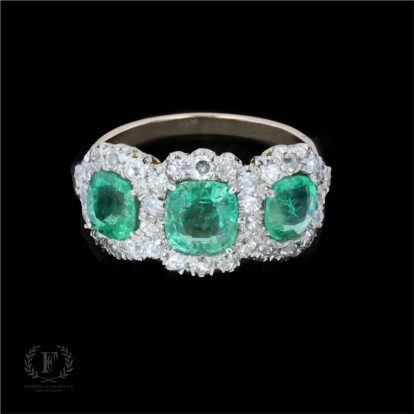 DIAMOND HALO EMERALD THREE STONE RING